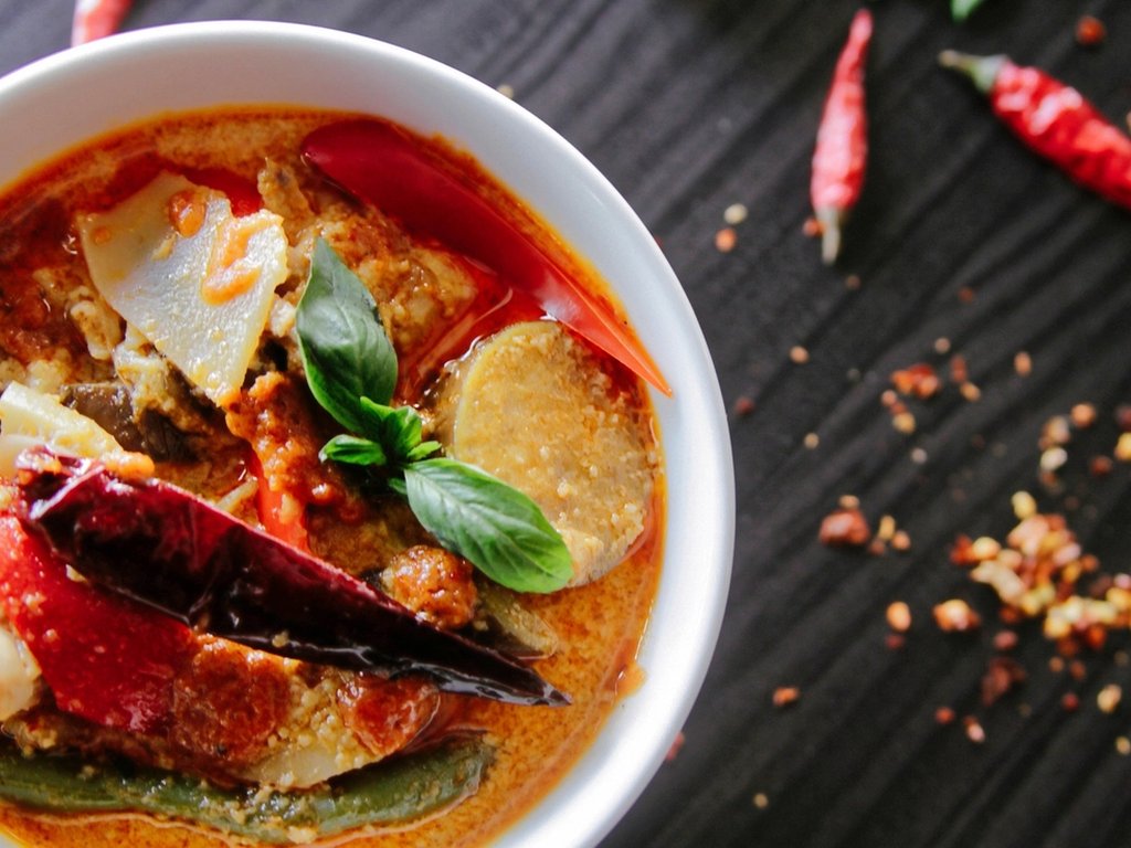 A bowl of red Thai curry, a dish from Thailand.